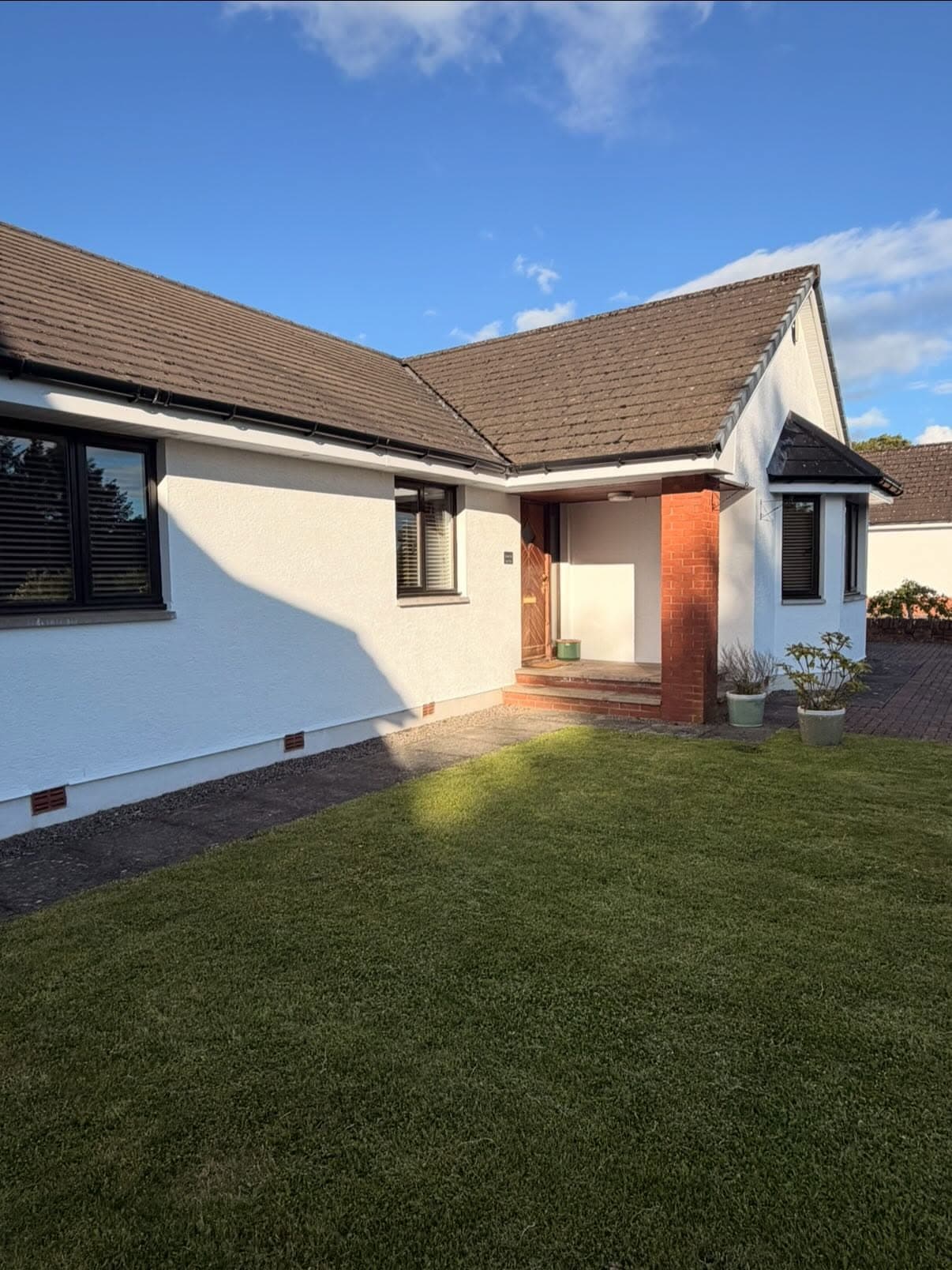 Exterior painting on a traditional property with weather-resistant finishes
